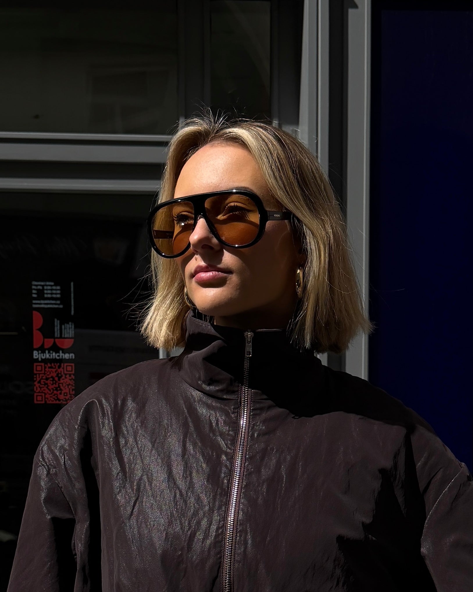 Sluneční brýle Komono Tate Black Amber